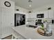 Bright kitchen with quartz countertops, island, and stainless steel appliances at 10345 Zebra Swallowtail St, Las Vegas, NV 89141