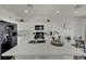 Modern kitchen with a large island, stainless steel appliances, and white cabinets at 10345 Zebra Swallowtail St, Las Vegas, NV 89141