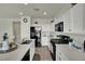 Bright kitchen with quartz countertops, island, and stainless steel appliances at 10345 Zebra Swallowtail St, Las Vegas, NV 89141