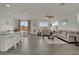 Open floor plan showcasing the kitchen, dining, and living areas with stylish decor at 10345 Zebra Swallowtail St, Las Vegas, NV 89141