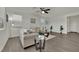 Cozy living room with tile floors, neutral-toned furniture, and stylish decor at 10345 Zebra Swallowtail St, Las Vegas, NV 89141