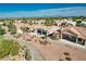 Features an aerial view of backyard patio furniture, desert landscaping, and a golf course at 10504 Button Willow Dr, Las Vegas, NV 89134