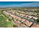 A community featuring palm trees and desert landscaping situated adjacent to a manicured golf course at 10504 Button Willow Dr, Las Vegas, NV 89134
