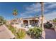 A beautiful backyard with patio, desert landscaping, palm trees, and plenty of room to relax at 10504 Button Willow Dr, Las Vegas, NV 89134