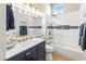 Stylish bathroom featuring double vanity, modern fixtures, and walk-in shower at 10504 Button Willow Dr, Las Vegas, NV 89134