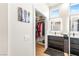 Bathroom showcasing double sinks, modern fixtures, and a walk-in closet for ample storage at 10504 Button Willow Dr, Las Vegas, NV 89134