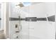 Elegant bathroom boasts white tile walls, a glass shower enclosure, and sleek gold fixtures at 10504 Button Willow Dr, Las Vegas, NV 89134