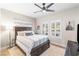 Comfortable bedroom with natural light, ceiling fan, and stylish decor at 10504 Button Willow Dr, Las Vegas, NV 89134