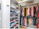 Spacious walk-in closet providing organized storage with shelves and hanging rods for clothing and shoes at 10504 Button Willow Dr, Las Vegas, NV 89134