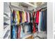 Walk-in closet with shelves and hanging rods for efficient storage of clothes and accessories at 10504 Button Willow Dr, Las Vegas, NV 89134