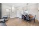 Elegant dining room with a stylish table, modern lighting, and a welcoming entrance at 10504 Button Willow Dr, Las Vegas, NV 89134