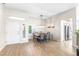 Open dining area with modern light fixture, wood-style flooring, and neutral color palette at 10504 Button Willow Dr, Las Vegas, NV 89134