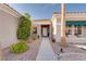 Charming home featuring desert landscaping leading up to a cozy and inviting front entrance with a tile roof at 10504 Button Willow Dr, Las Vegas, NV 89134