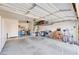Spacious garage with ample storage and well-organized shelving, perfect for hobbies and vehicles at 10504 Button Willow Dr, Las Vegas, NV 89134