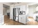 Kitchen area with stainless steel refrigerator and access to laundry room at 10504 Button Willow Dr, Las Vegas, NV 89134