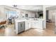 Bright, open kitchen with white cabinets, stainless steel appliances, and a spacious island at 10504 Button Willow Dr, Las Vegas, NV 89134