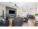 Bright, open-concept living space with a modern fireplace, dining area, and stylish furnishings at 10504 Button Willow Dr, Las Vegas, NV 89134
