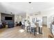 Open-concept design combining living, kitchen, and dining spaces with modern finishes and ample seating at 10504 Button Willow Dr, Las Vegas, NV 89134