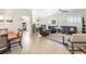 Expansive living area featuring an open layout connecting the living room, kitchen, and dining spaces at 10504 Button Willow Dr, Las Vegas, NV 89134