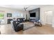 Inviting living room with sleek fireplace feature wall, stylish furniture, and light-filled windows at 10504 Button Willow Dr, Las Vegas, NV 89134
