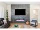 Contemporary living room showcasing a modern fireplace, large TV, and chic decor at 10504 Button Willow Dr, Las Vegas, NV 89134