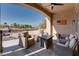 Relaxing covered patio area with stylish seating and a picturesque view of the golf course at 10504 Button Willow Dr, Las Vegas, NV 89134