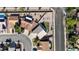 A bird's eye view of a house with a well-maintained backyard in a neighborhood with tree-lined streets at 1079 Oak Shade Ln, Henderson, NV 89015