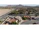 A neighborhood view highlighting a single-Gathering home with beautiful mountain views in the distance at 1079 Oak Shade Ln, Henderson, NV 89015