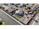 Aerial view of home showing its landscaped backyard with green grass and play area at 1079 Oak Shade Ln, Henderson, NV 89015