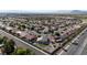 An aerial view showing home with backyard and play area nestled in a desert community at 1079 Oak Shade Ln, Henderson, NV 89015
