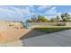 Expansive backyard featuring a playground, patio, and gravel landscaping at 1079 Oak Shade Ln, Henderson, NV 89015