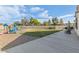 Expansive backyard featuring a playground, patio, and gravel landscaping at 1079 Oak Shade Ln, Henderson, NV 89015