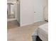 Bright bedroom with view into hallway, carpet flooring, and neutral wall color at 1079 Oak Shade Ln, Henderson, NV 89015