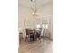 Dining room featuring natural light and a stylish chandelier above a wood table at 1079 Oak Shade Ln, Henderson, NV 89015