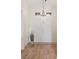 Bright entryway with double doors, stylish overhead lighting and wood flooring, setting a welcoming tone at 1079 Oak Shade Ln, Henderson, NV 89015