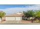 Charming home featuring a three-car garage, well-maintained landscaping, and a tile roof at 1079 Oak Shade Ln, Henderson, NV 89015