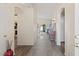 Bright foyer with wood-look flooring, arched doorway, and neutral paint at 1079 Oak Shade Ln, Henderson, NV 89015