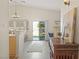 Open-concept kitchen flowing into the living area, featuring a breakfast bar and bright natural light at 1079 Oak Shade Ln, Henderson, NV 89015