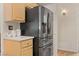 Kitchen featuring stainless steel refrigerator and ample cabinets for storage at 1079 Oak Shade Ln, Henderson, NV 89015
