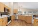 Spacious kitchen with stainless steel appliances and lots of natural light from the big windows at 1079 Oak Shade Ln, Henderson, NV 89015
