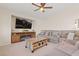 Cozy living room featuring a large sectional sofa and a mounted TV at 1079 Oak Shade Ln, Henderson, NV 89015