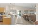 Open-concept living space featuring kitchen, living room, and backyard access at 1079 Oak Shade Ln, Henderson, NV 89015