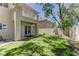 Lush backyard featuring a well-maintained lawn, mature trees, and outdoor living space at 108 Broken Rock Dr, Henderson, NV 89074
