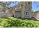 Spacious backyard with healthy grass, shade trees, and direct access to patio and home at 108 Broken Rock Dr, Henderson, NV 89074