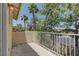 View of the balcony with white railing and palm trees in the background on a sunny day at 108 Broken Rock Dr, Henderson, NV 89074
