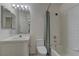 Tiled bathroom features a shower-tub combo with a white vanity and coordinated mirror at 108 Broken Rock Dr, Henderson, NV 89074