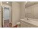 Well-lit bathroom featuring a single vanity sink, white tile countertops, and a glass enclosed shower at 108 Broken Rock Dr, Henderson, NV 89074