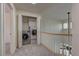 Upstairs hallway featuring a laundry nook with open doors and modern appliances at 108 Broken Rock Dr, Henderson, NV 89074