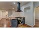 Open-concept kitchen with a gas stovetop, modern appliances, hardwood flooring, and ample space for entertaining guests at 108 Broken Rock Dr, Henderson, NV 89074