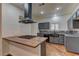 Stylish kitchen with modern stainless steel appliances, sleek countertops, and contemporary cabinetry, a chef's delight at 108 Broken Rock Dr, Henderson, NV 89074